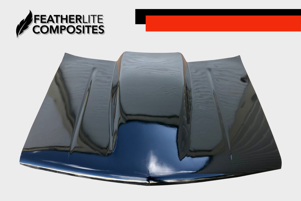 Black Chevy 1500 Hood for years 88-98 by Featherlite Composites.  Made of  fiberglass.  