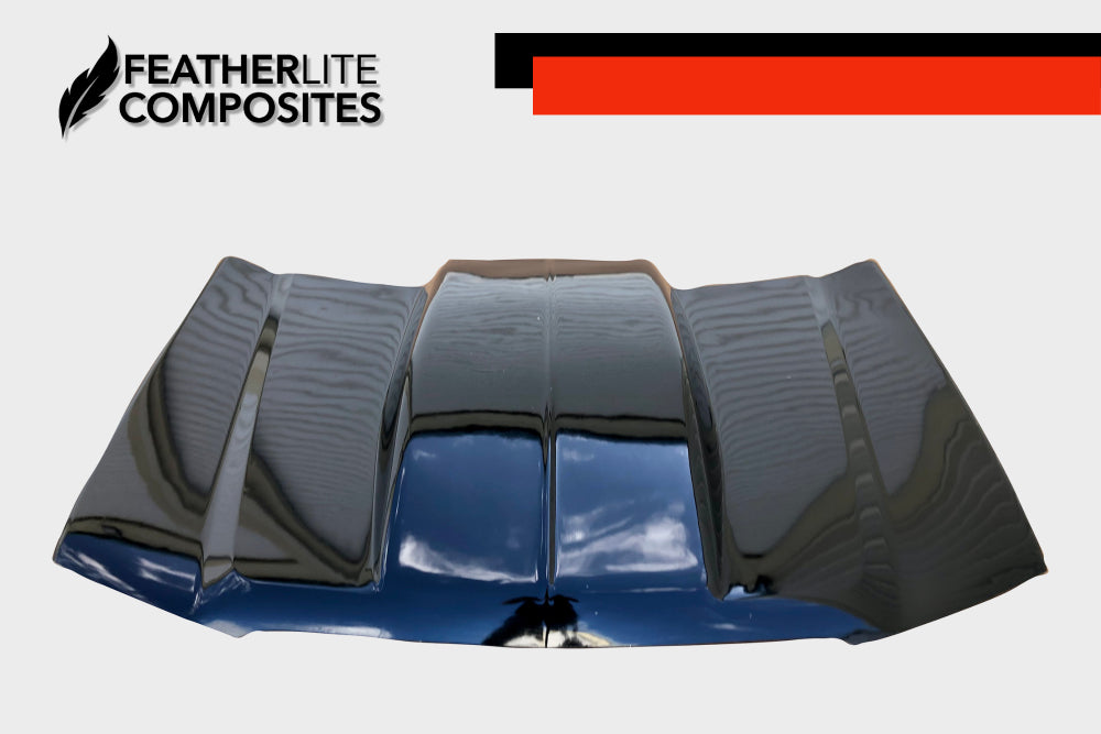 Black Chevy 1500 Hood for years 03-05 by Featherlite Composites.  Made of  fiberglass.  